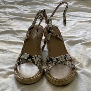 Black and white wedge sandals.